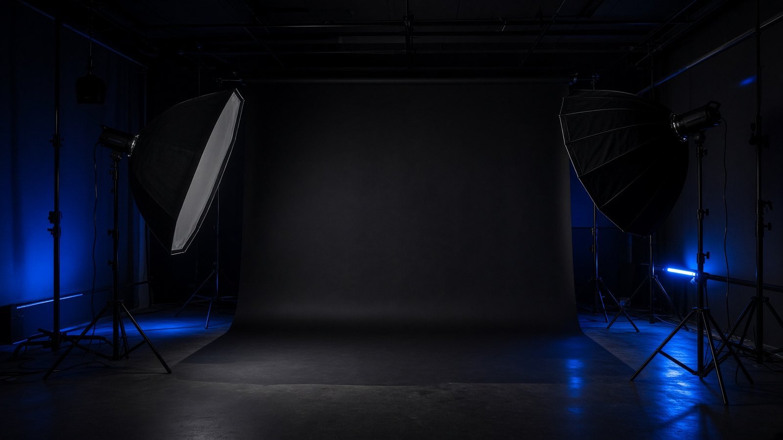 Dark studio with lighting equipment
